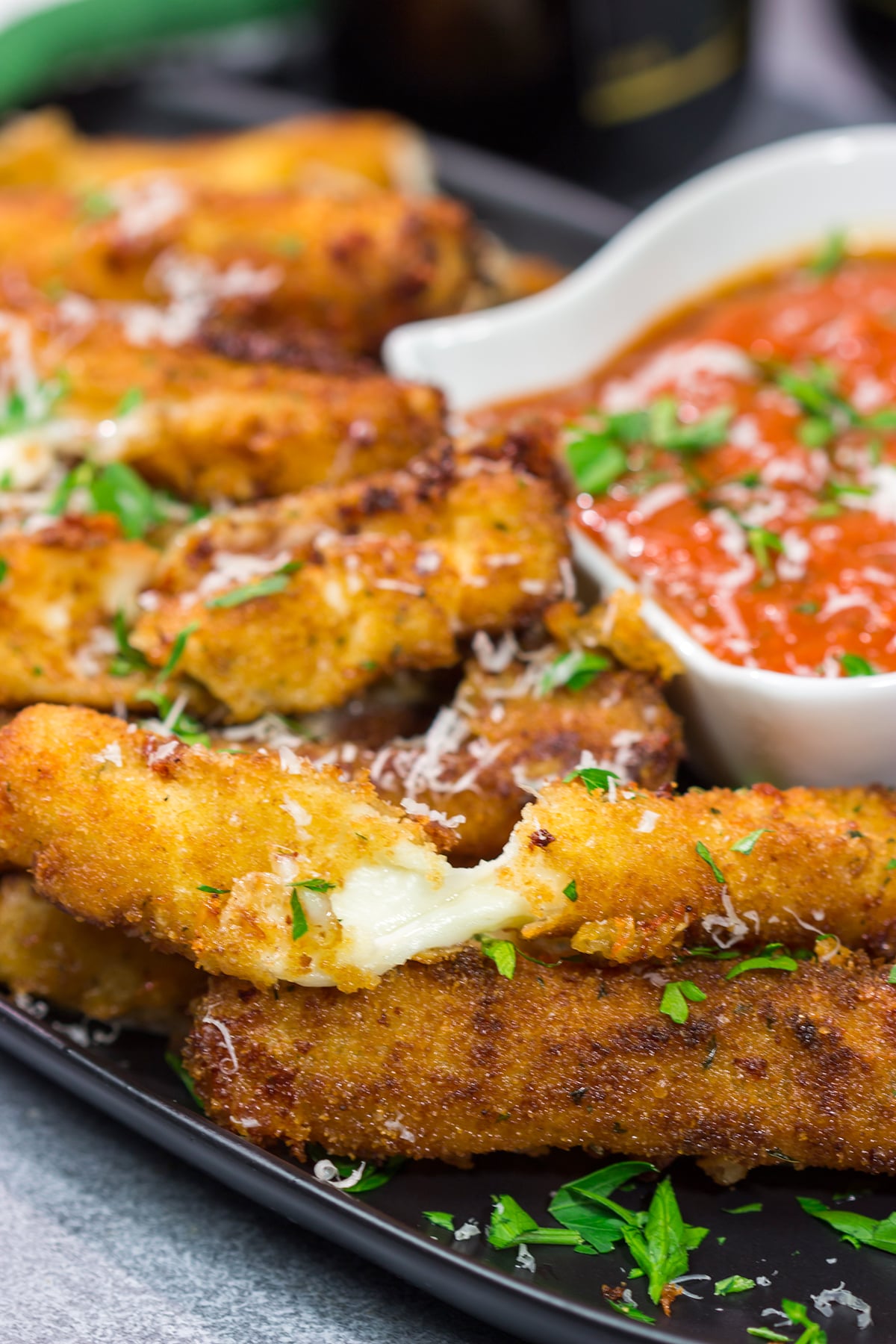 Make your own homemade Fried Mozzarella Sticks and serve 'em with warm marinara sauce. These make a great appetizer for game nights with friends!
