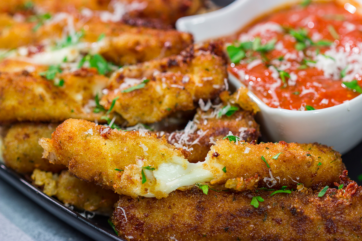 Make your own homemade Fried Mozzarella Sticks and serve 'em with warm marinara sauce. These make a great appetizer for game nights with friends!
