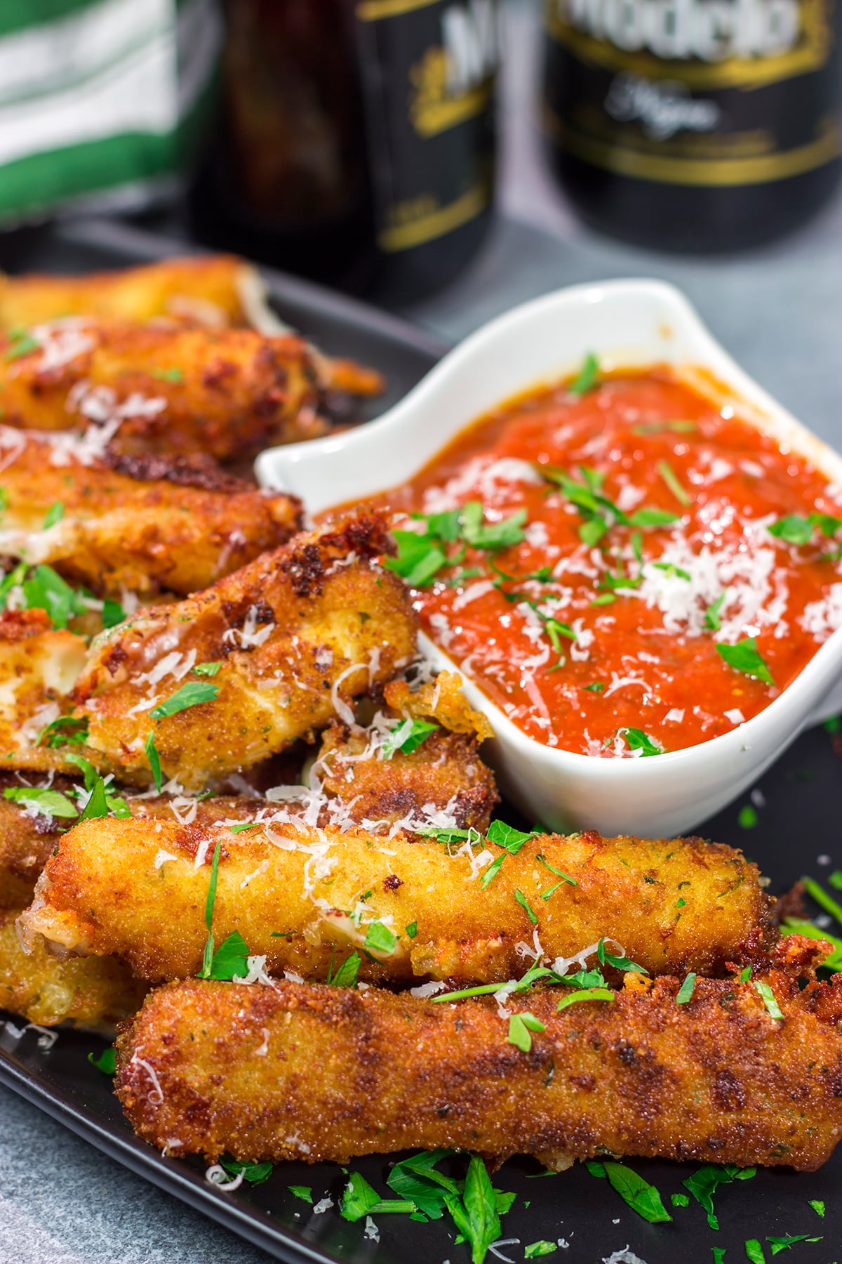 Make your own homemade Fried Mozzarella Sticks and serve 'em with warm marinara sauce. These make a great appetizer for game nights with friends!