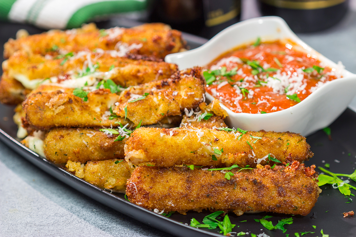 Make your own homemade Fried Mozzarella Sticks and serve 'em with warm marinara sauce. These make a great appetizer for game nights with friends!