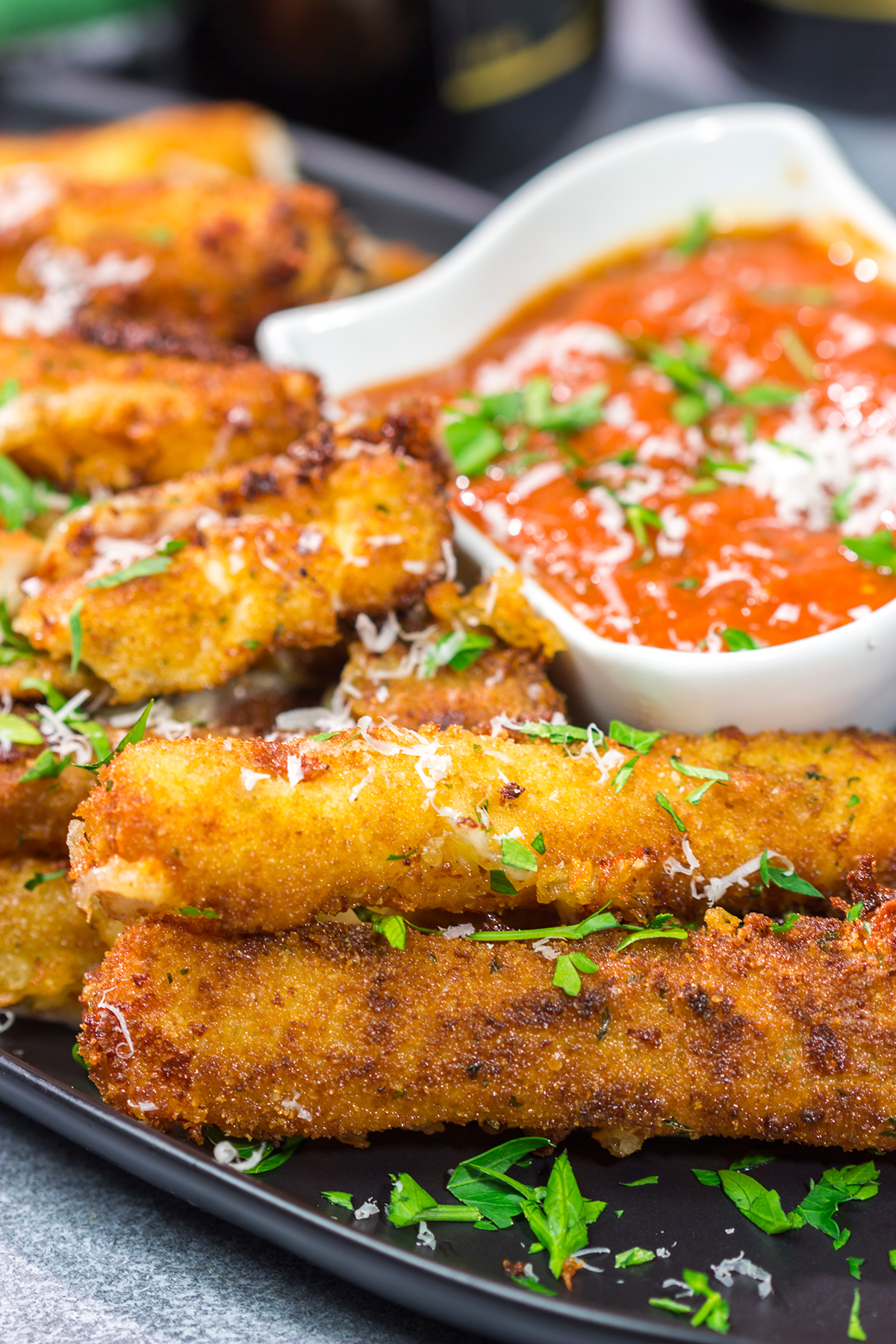 Make your own homemade Fried Mozzarella Sticks and serve 'em with warm marinara sauce. These make a great appetizer for game nights with friends!