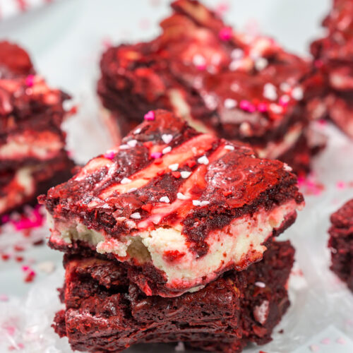 These Red Velvet Cheesecake Brownies feature tasty brownies swirled with a layer of cheesecake. They're a great dessert for Valentine's Day or Christmas!