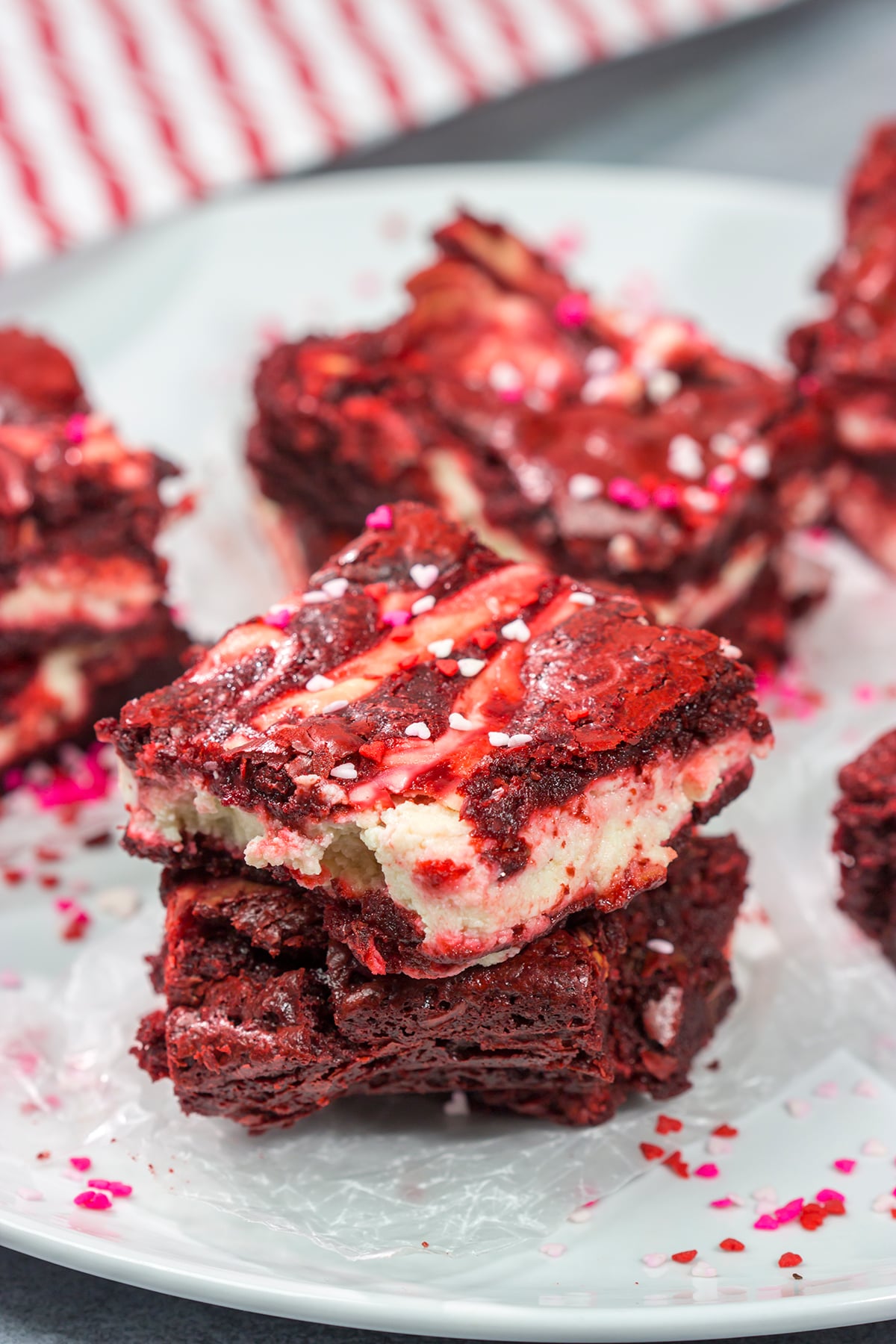 These Red Velvet Cheesecake Brownies feature tasty brownies swirled with a layer of cheesecake. They're a great dessert for Valentine's Day or Christmas!