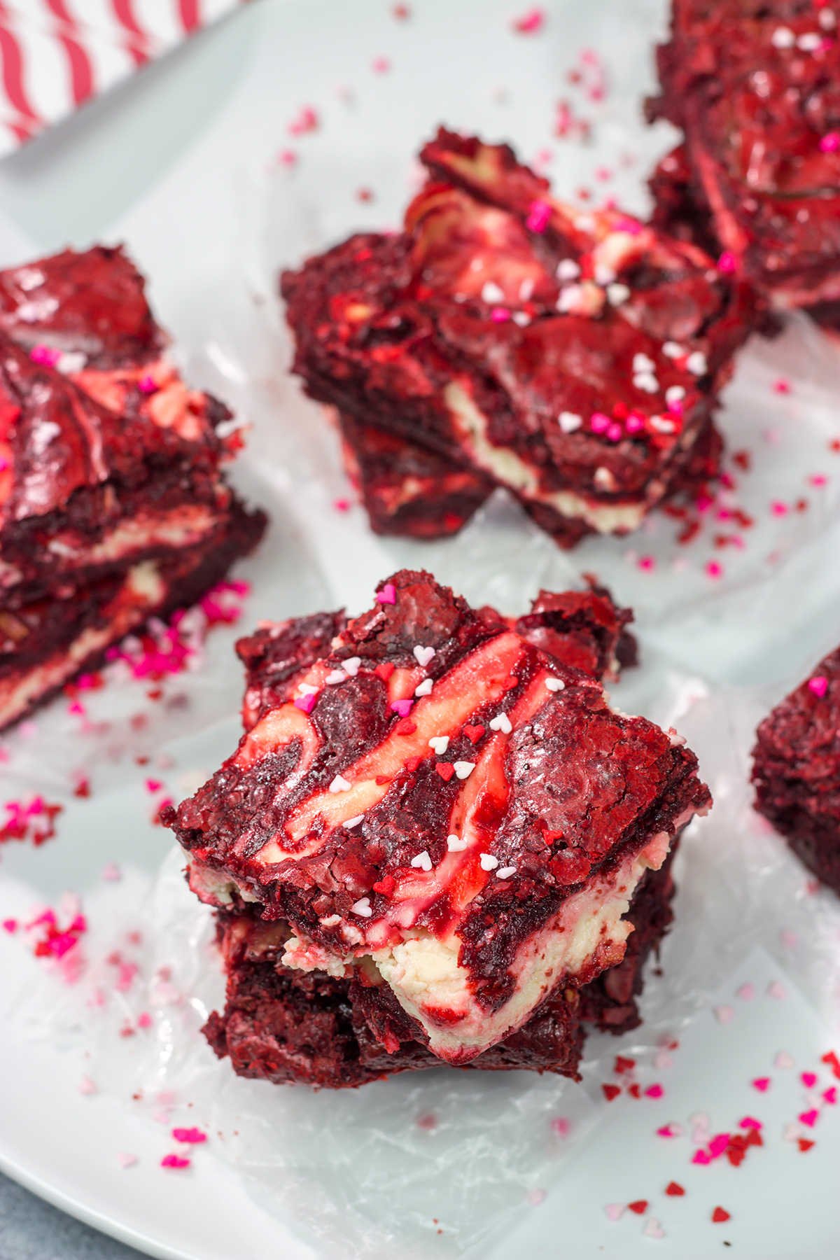 These Red Velvet Cheesecake Brownies feature tasty brownies swirled with a layer of cheesecake. They're a great dessert for Valentine's Day or Christmas!