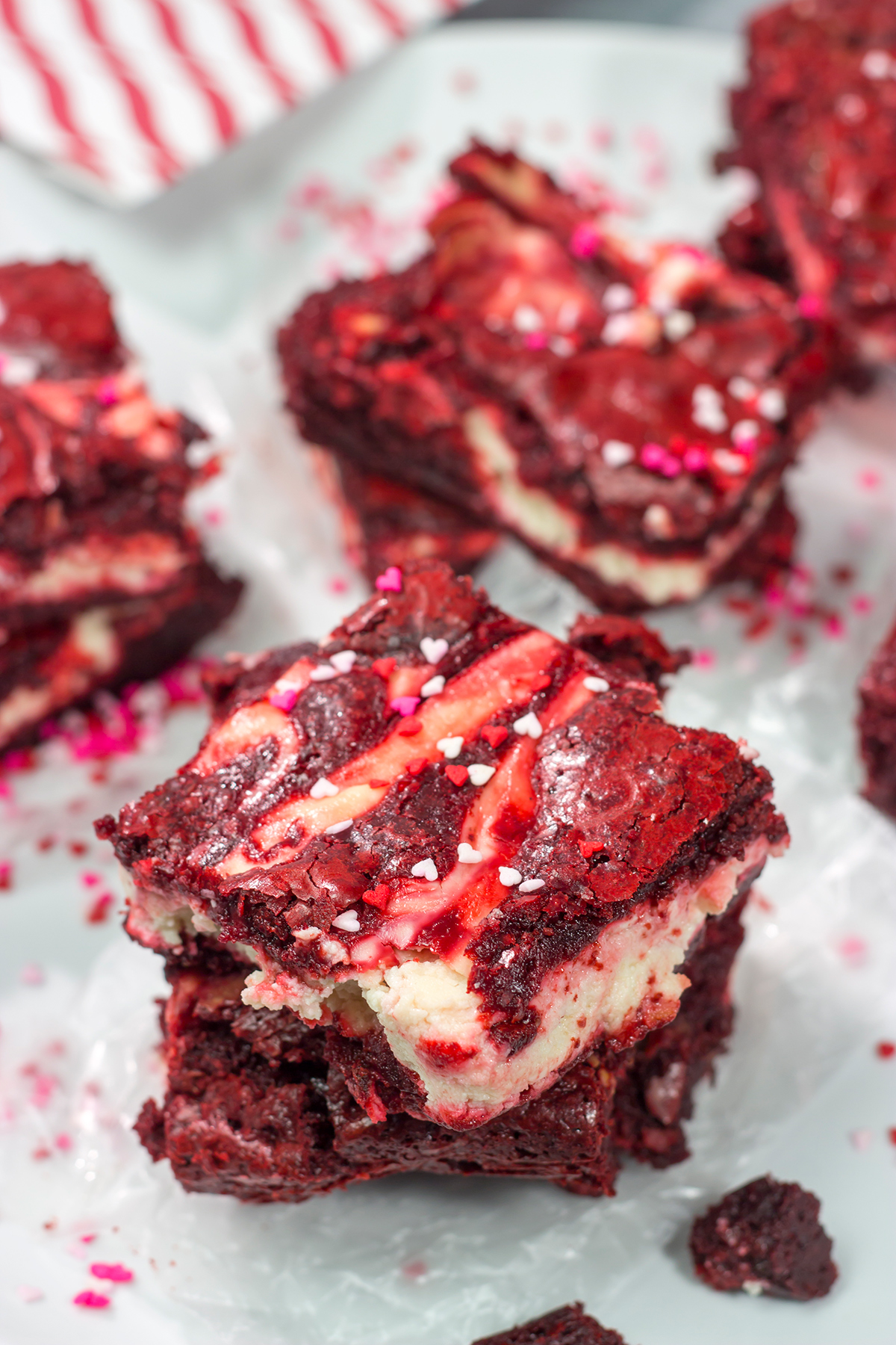 These Red Velvet Cheesecake Brownies feature tasty brownies swirled with a layer of cheesecake. They're a great dessert for Valentine's Day or Christmas!