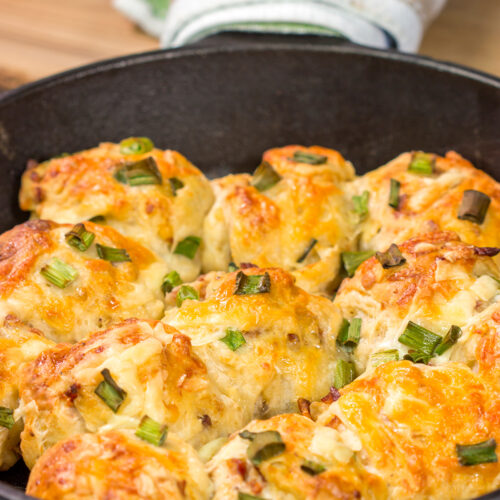 Take your dinner rolls to a whole new level! These Bacon Cheddar Rolls are packed with crispy bacon and sharp cheddar cheese. Yum!