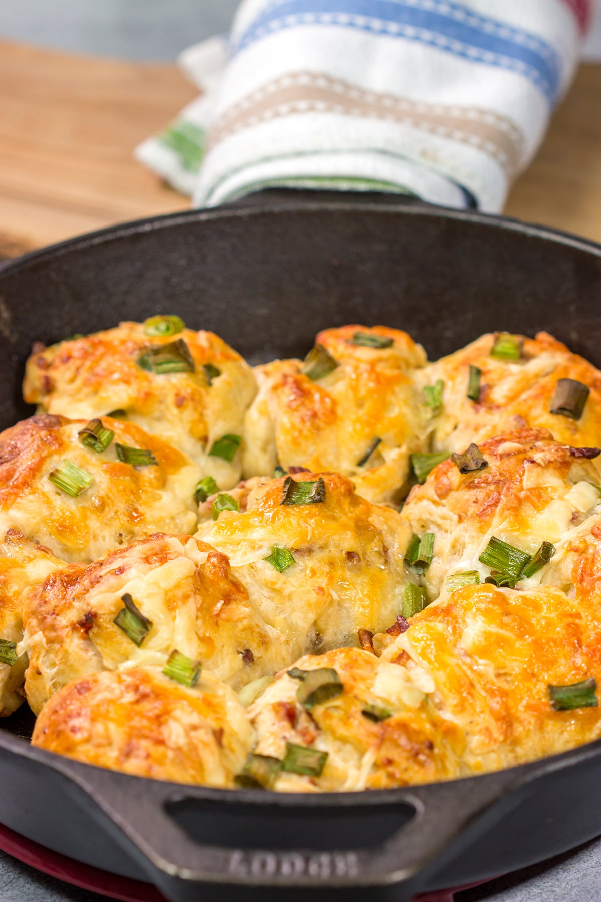 Take your dinner rolls to a whole new level! These Bacon Cheddar Rolls are packed with crispy bacon and sharp cheddar cheese. Yum!