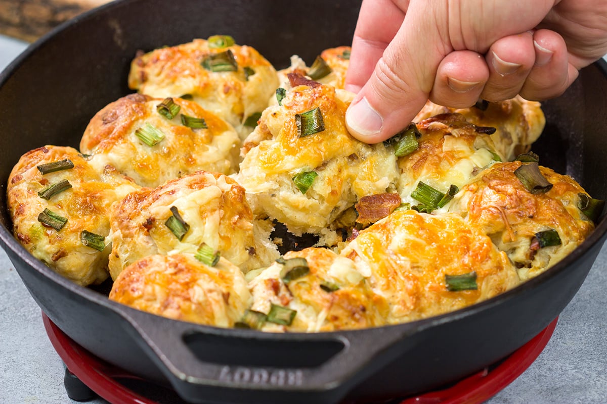 Take your dinner rolls to a whole new level! These Bacon Cheddar Rolls are packed with crispy bacon and sharp cheddar cheese. Yum!