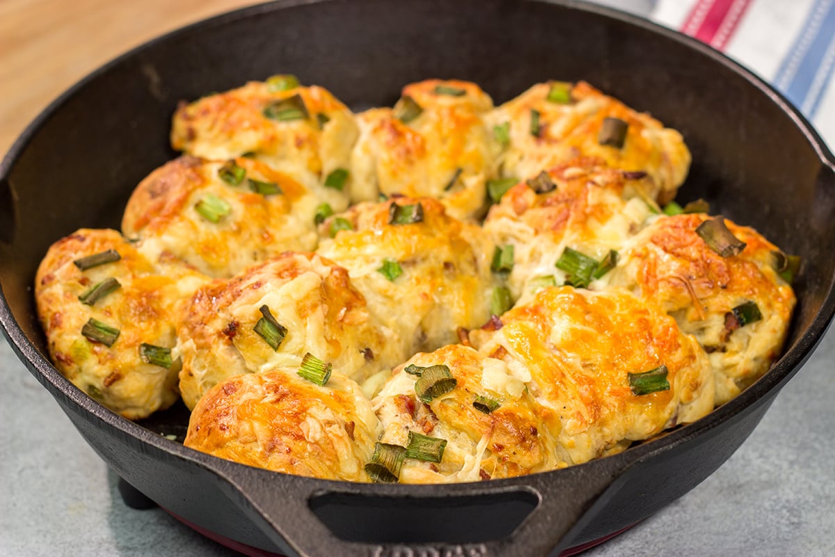 Take your dinner rolls to a whole new level! These Bacon Cheddar Rolls are packed with crispy bacon and sharp cheddar cheese. Yum!