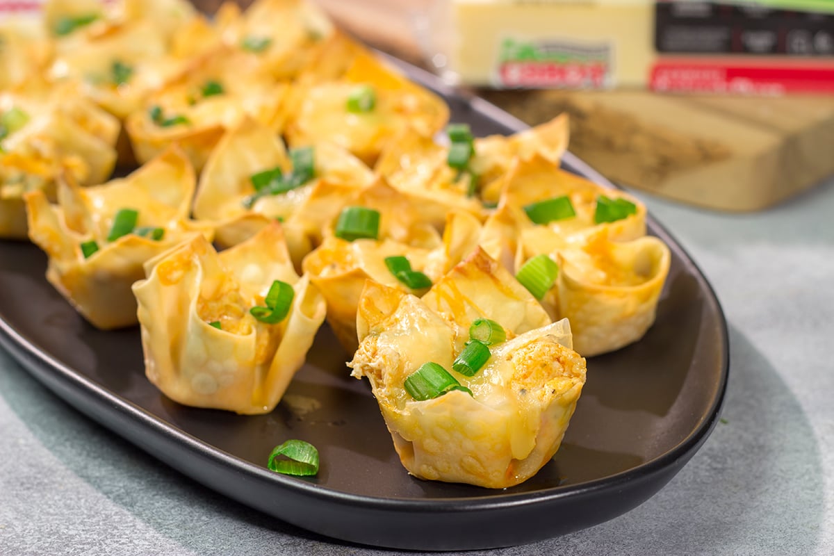 These Buffalo Chicken Wonton Cups feature creamy, mouthwatering buffalo chicken dip...in a bite-sized form!