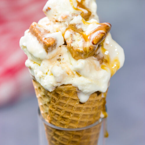 This Caramel Praline Ice Cream features a creamy vanilla base filled with nutty crumbled pralines. It's delicious, and it's perfect for a hot summer day!
