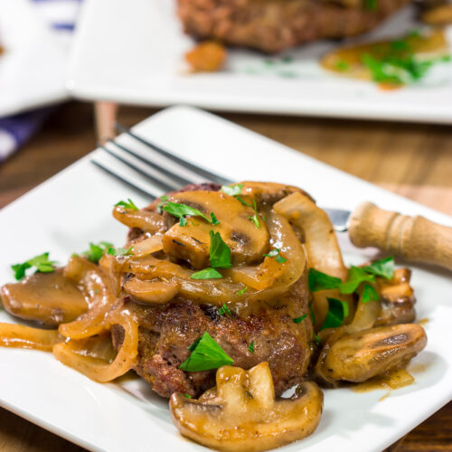 These Hamburger Steaks with Gravy are a classic comfort food...and they're easy enough to make as a weeknight meal!