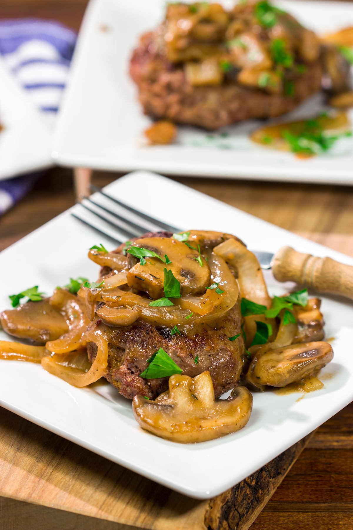 These Hamburger Steaks with Gravy are a classic comfort food...and they're easy enough to make as a weeknight meal!