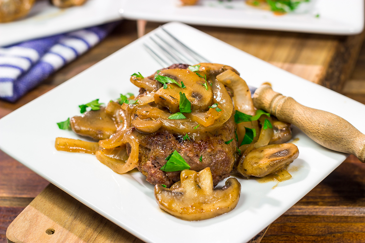 These Hamburger Steaks with Gravy are a classic comfort food...and they're easy enough to make as a weeknight meal!