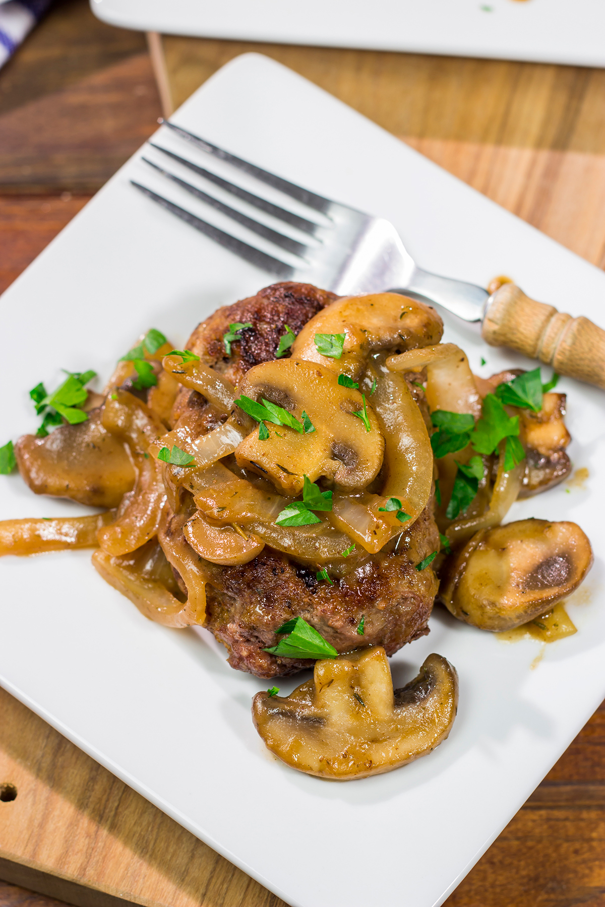 These Hamburger Steaks with Gravy are a classic comfort food...and they're easy enough to make as a weeknight meal!