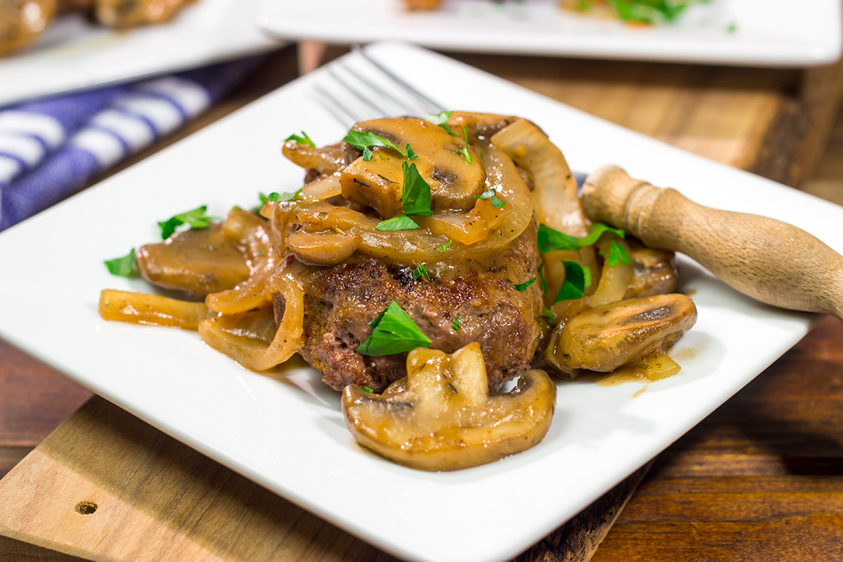 These Hamburger Steaks with Gravy are a classic comfort food...and they're easy enough to make as a weeknight meal!