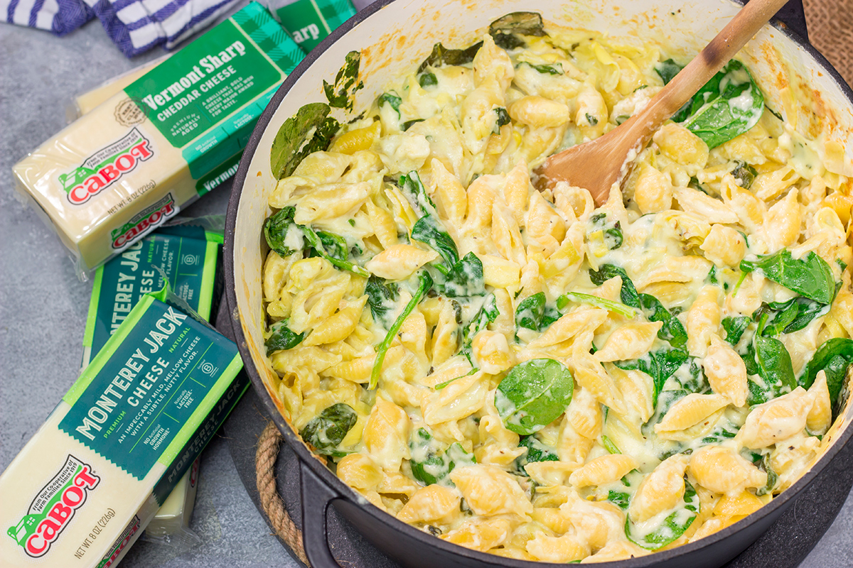Elevate your mac and cheese game with this Spinach Artichoke Mac and Cheese. This bold and creamy recipe is the ultimate definition of comfort food!