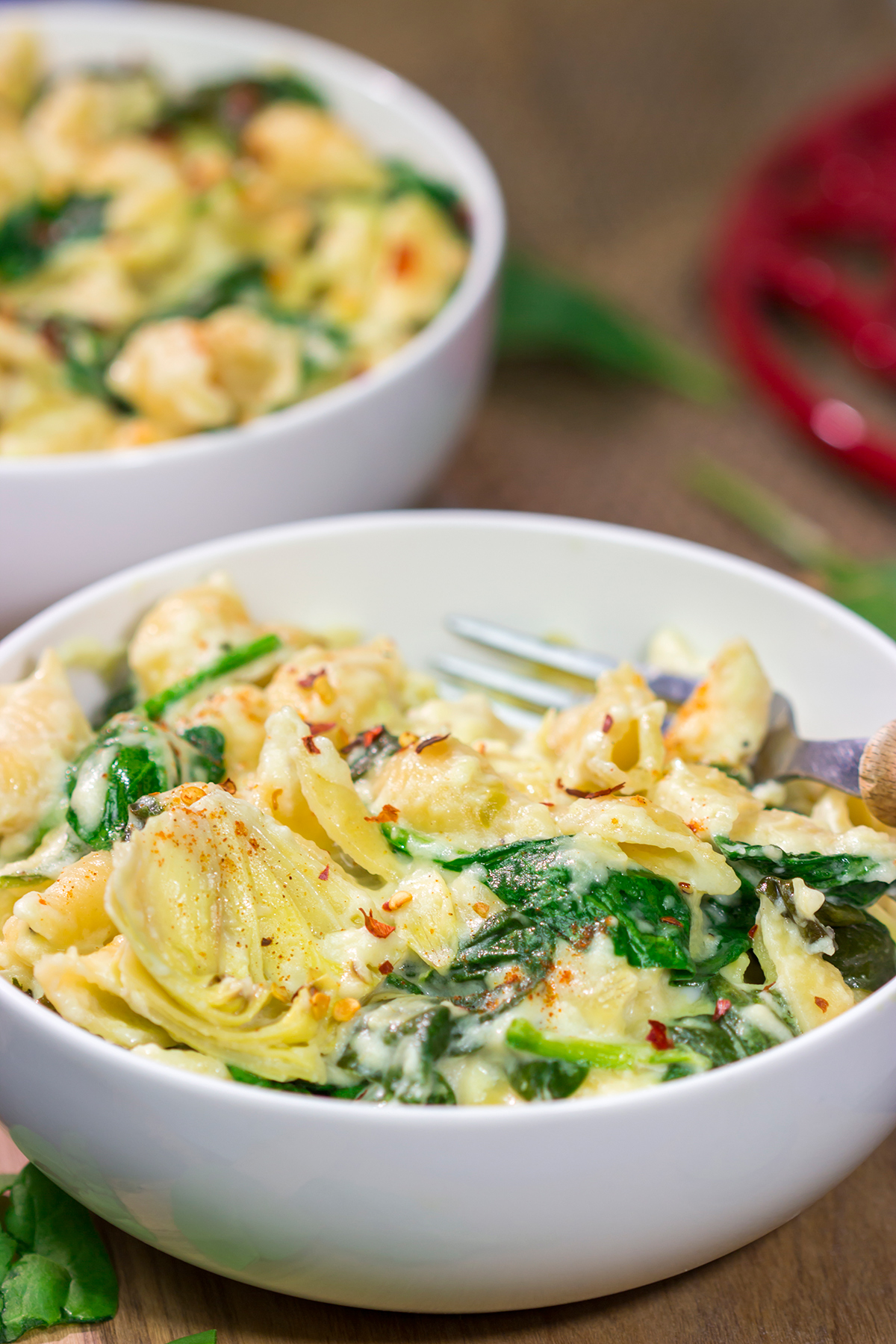 Elevate your mac and cheese game with this Spinach Artichoke Mac and Cheese. This bold and creamy recipe is the ultimate definition of comfort food!