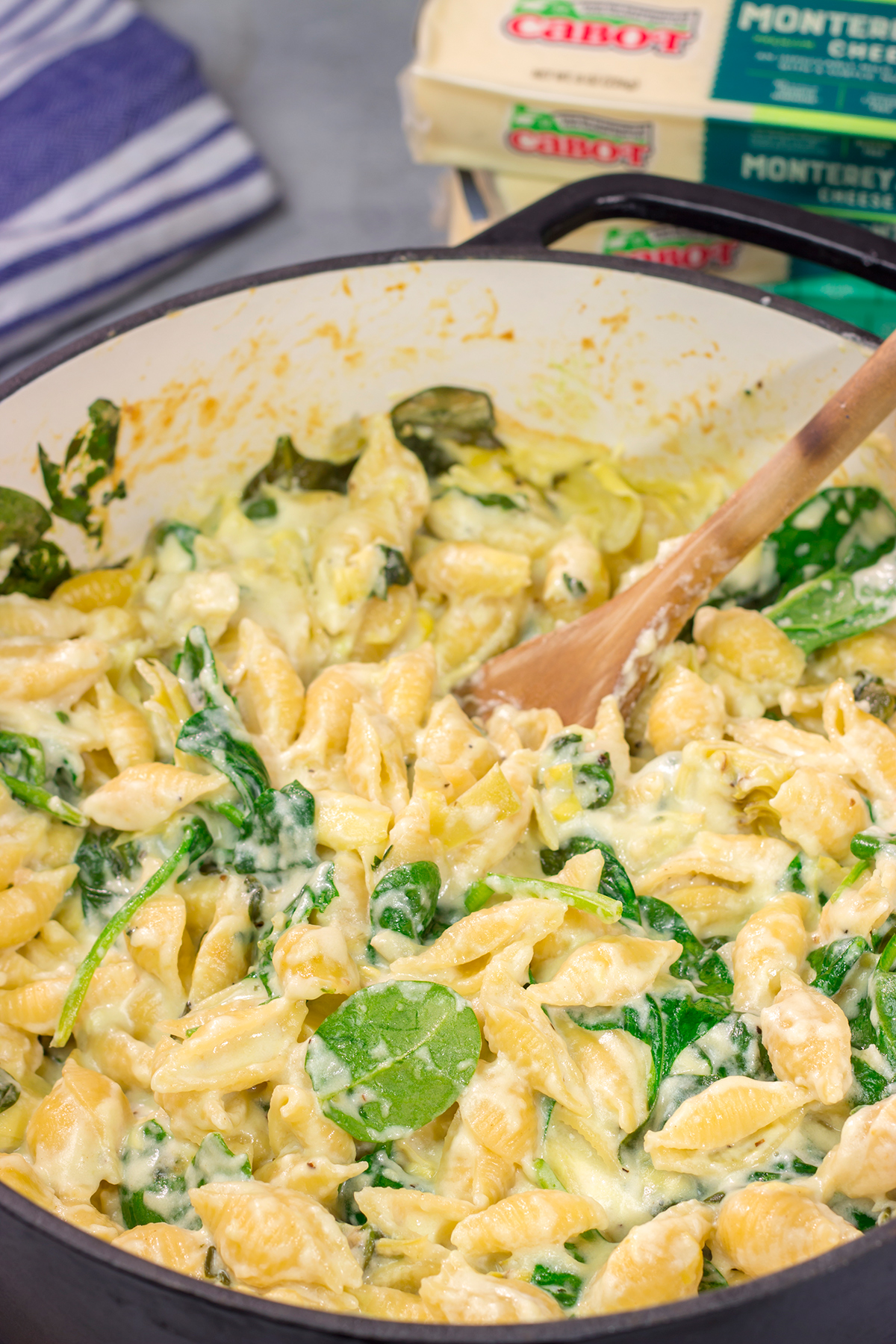 Elevate your mac and cheese game with this Spinach Artichoke Mac and Cheese. This bold and creamy recipe is the ultimate definition of comfort food!