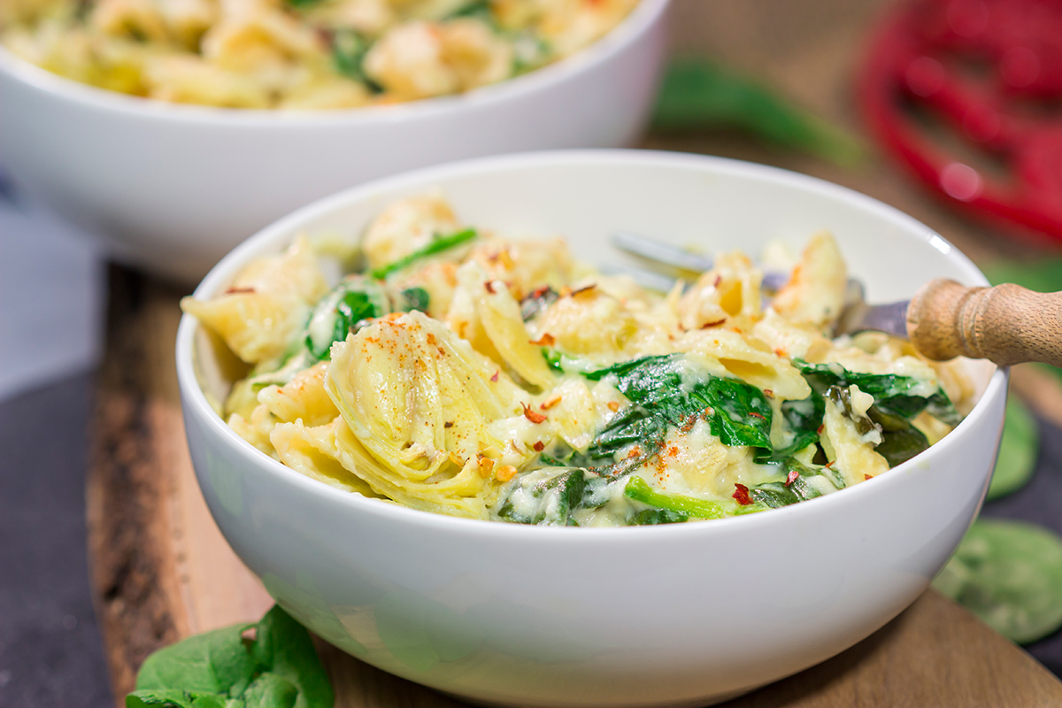 Elevate your mac and cheese game with this Spinach Artichoke Mac and Cheese. This bold and creamy recipe is the ultimate definition of comfort food!