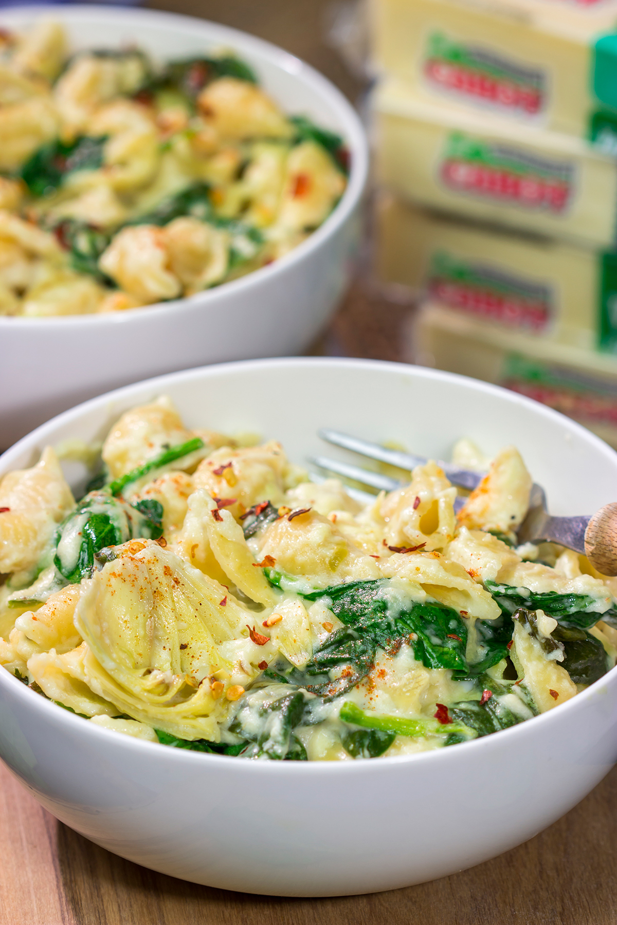 Elevate your mac and cheese game with this Spinach Artichoke Mac and Cheese. This bold and creamy recipe is the ultimate definition of comfort food!