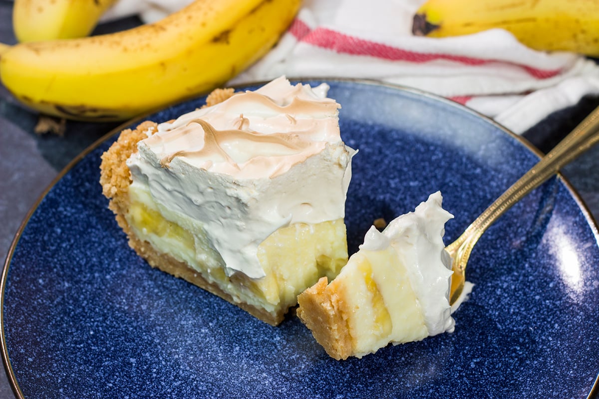 This Banana Pudding Pie features a creamy banana pudding base topped with a light and airy meringue. It's a combination of two favorites in one!