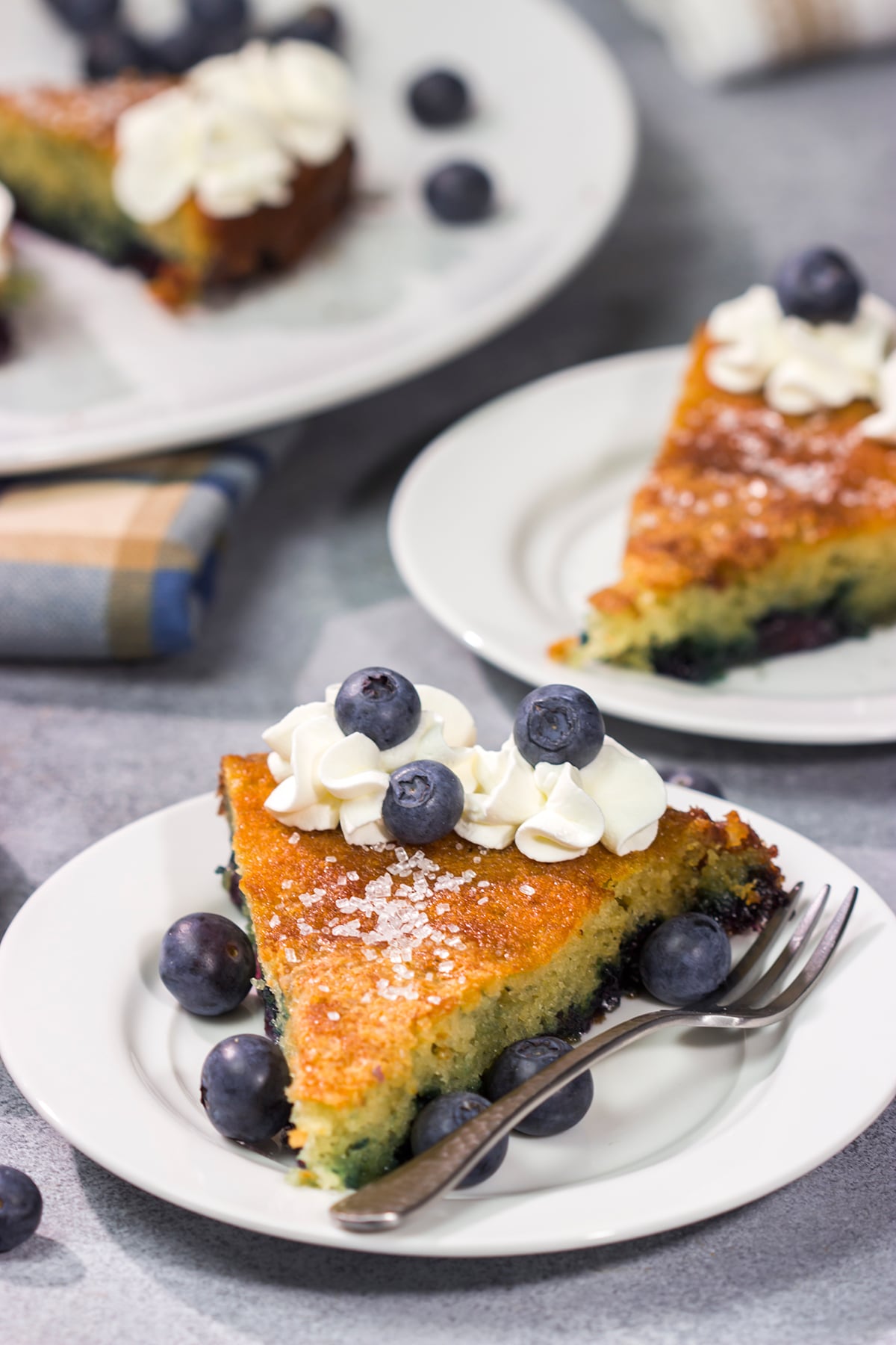 This Blueberry Buttermilk Cake is sweet, tangy...and super easy to make! It's a great recipe for warm summer mornings.