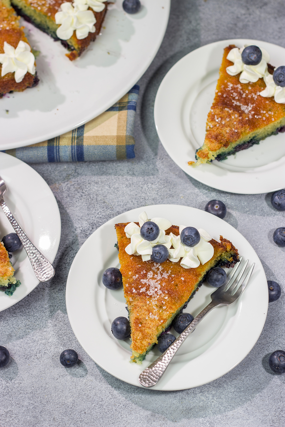 This Blueberry Buttermilk Cake is sweet, tangy...and super easy to make! It's a great recipe for warm summer mornings.