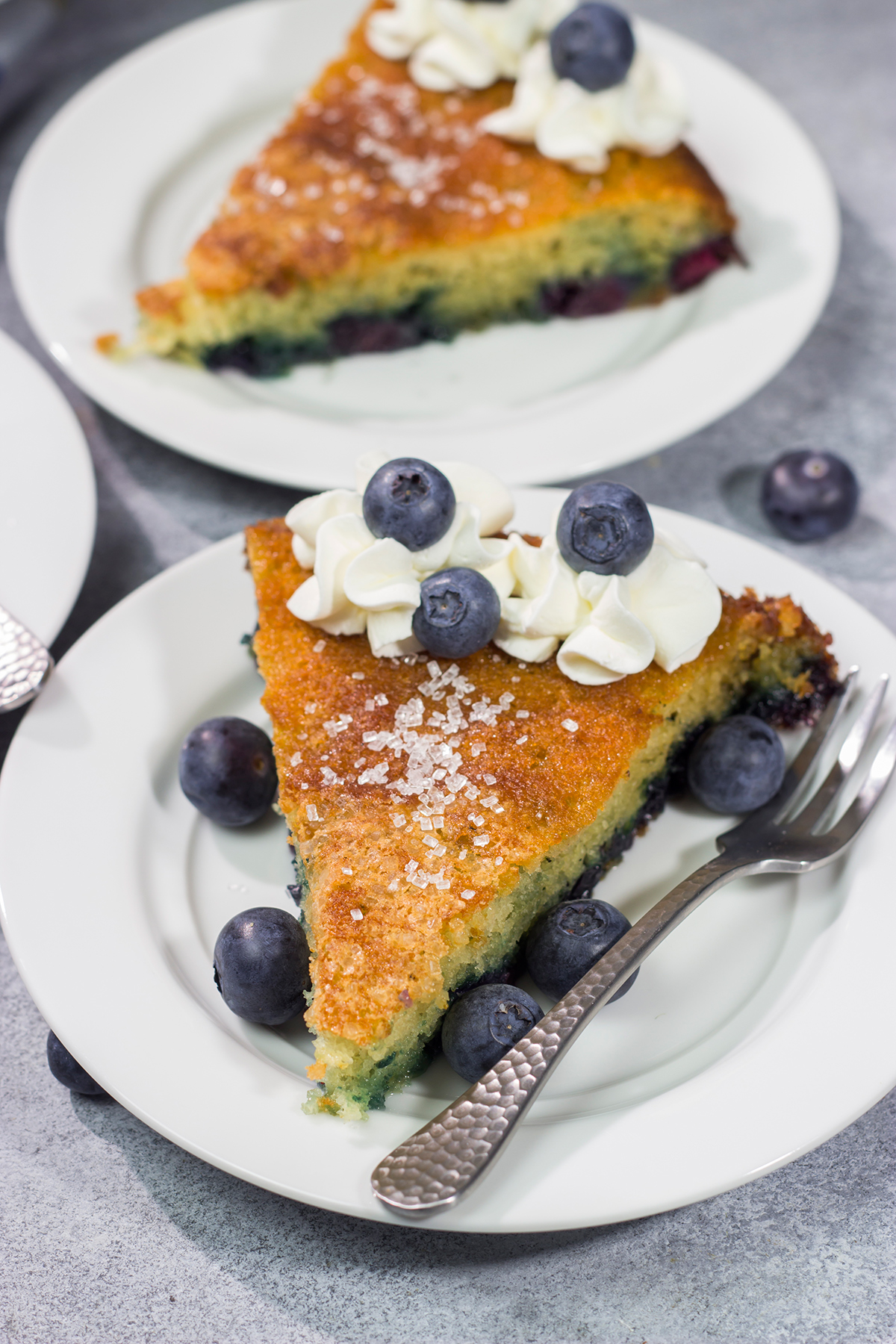 This Blueberry Buttermilk Cake is sweet, tangy...and super easy to make! It's a great recipe for warm summer mornings.
