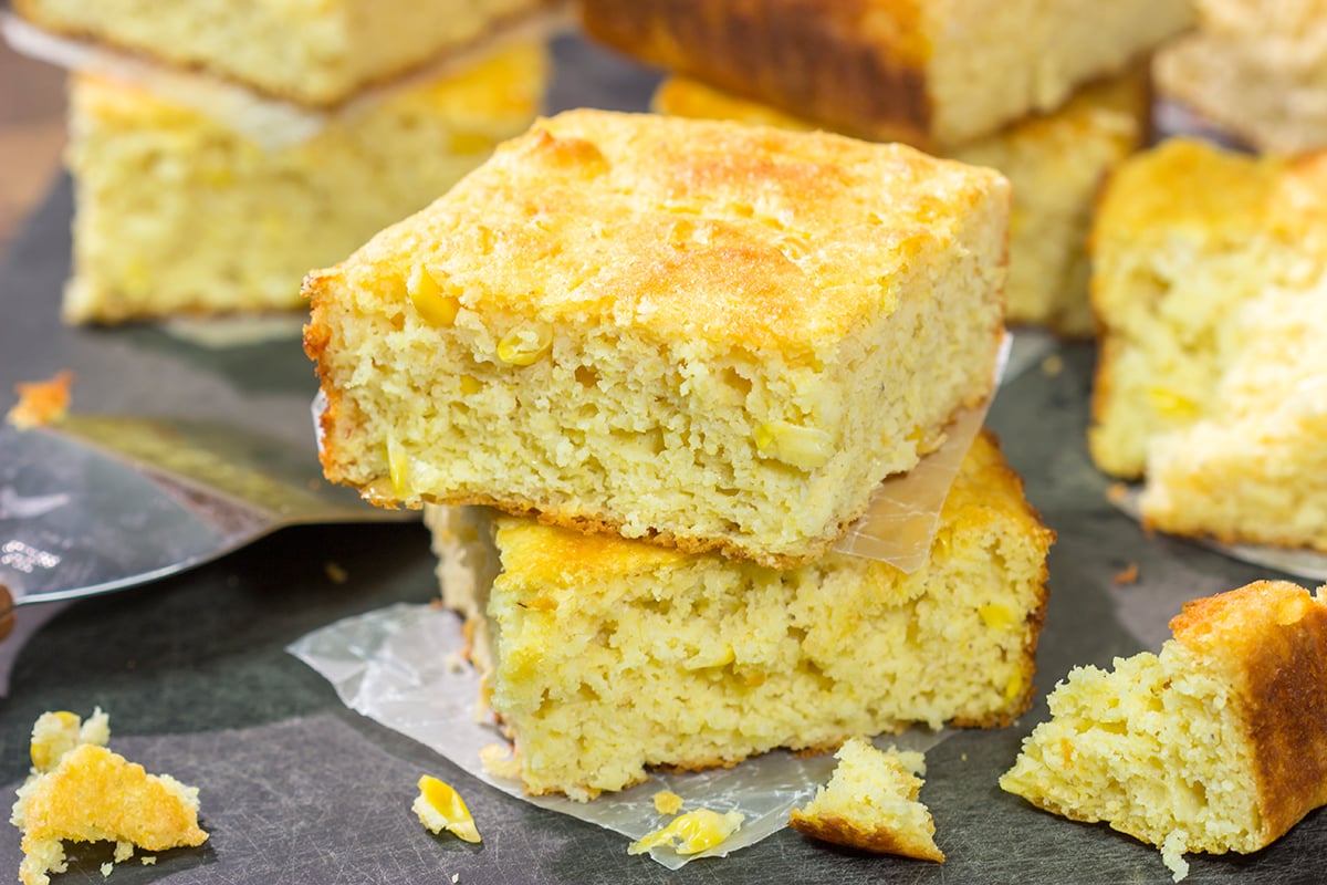 This Cornbread with Creamed Corn recipe is a mouthwatering recipe that can be whipped up in about 10 minutes. It's a delicious year-round side dish!