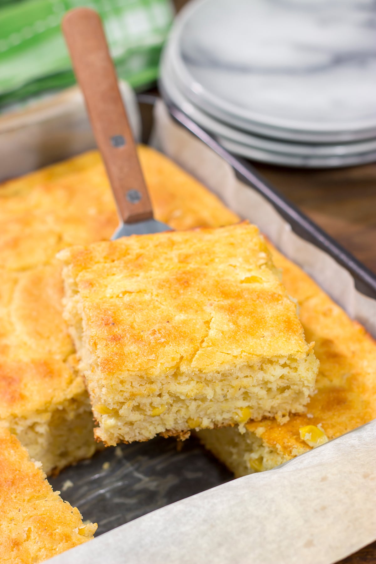 This Cornbread with Creamed Corn recipe is a mouthwatering recipe that can be whipped up in about 10 minutes. It's a delicious year-round side dish!