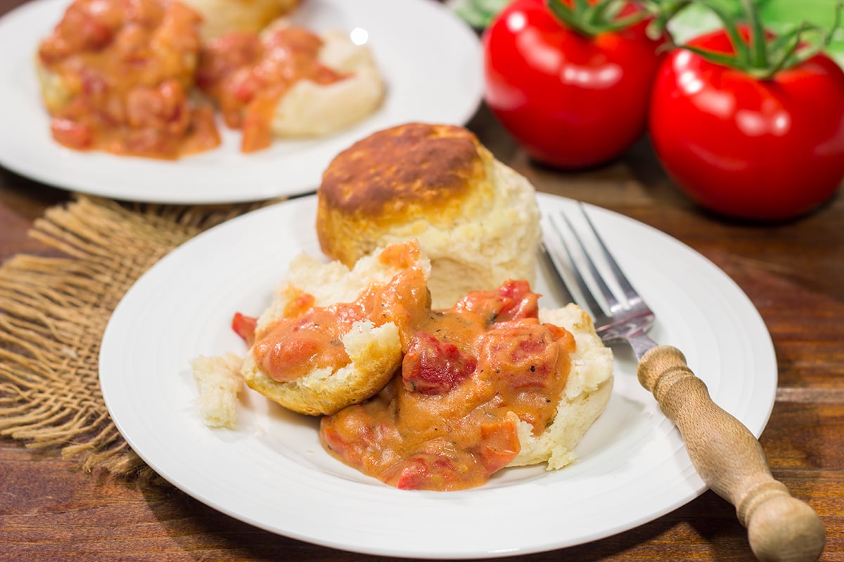 Tomato Gravy is a delicious way to celebrate tomato season! Serve with buttermilk biscuits, grits or meatloaf for a tasty meal.