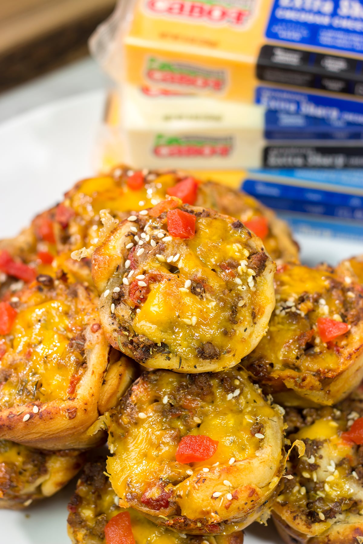 Skip the buns and grab some pizza dough instead! These Cheeseburger Pinwheels feature seasoned beef with cheddar cheese...and they're baked in a muffin tin!