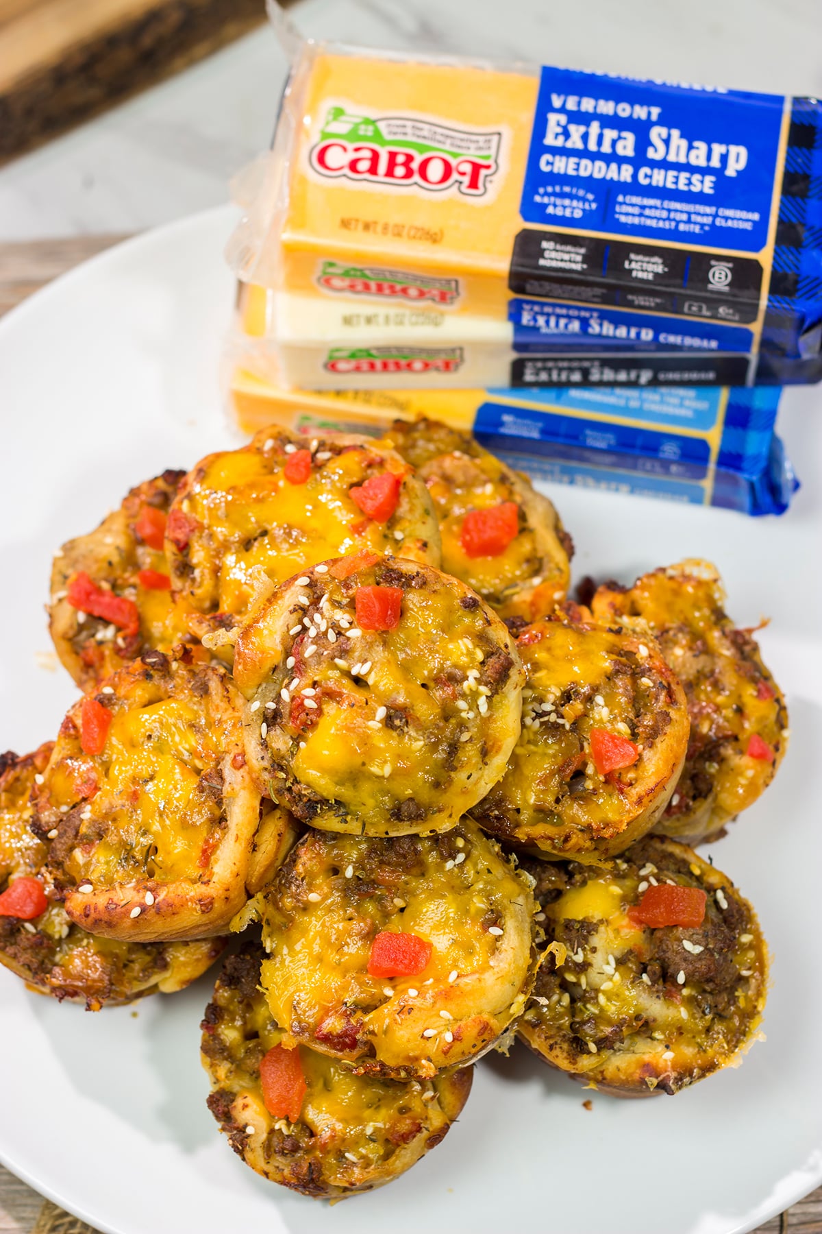Skip the buns and grab some pizza dough instead! These Cheeseburger Pinwheels feature seasoned beef with cheddar cheese...and they're baked in a muffin tin!