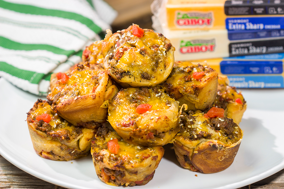 Skip the buns and grab some pizza dough instead! These Cheeseburger Pinwheels feature seasoned beef with cheddar cheese...and they're baked in a muffin tin!