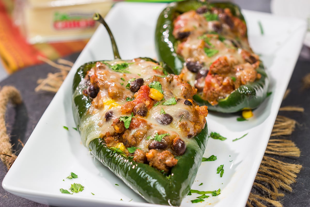 Mix up taco night with these Cheesy Stuffed Poblano Peppers! This flavor-packed recipe makes for a fun and delicious meal that is sure to become a family favorite.