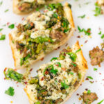 This Sausage and Broccoli Rabe Cheesy Bread a fun and delicious twist on the classic Italian pasta dish. Put it on the menu soon!