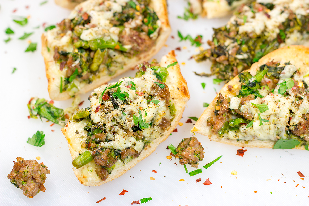 This Sausage and Broccoli Rabe Cheesy Bread a fun and delicious twist on the classic Italian pasta dish. Put it on the menu soon!