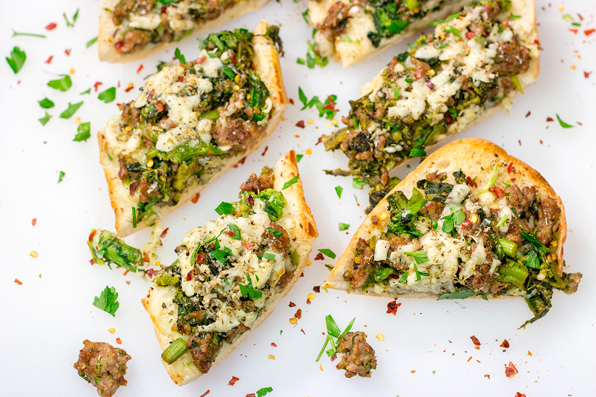This Sausage and Broccoli Rabe Cheesy Bread a fun and delicious twist on the classic Italian pasta dish. Put it on the menu soon!