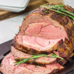 Smoked Prime Rib is a company worthy meal! This prime rib roast (aka standing rib roast) is slow-smoked for flavor and then seared to create a delicious exterior crust.