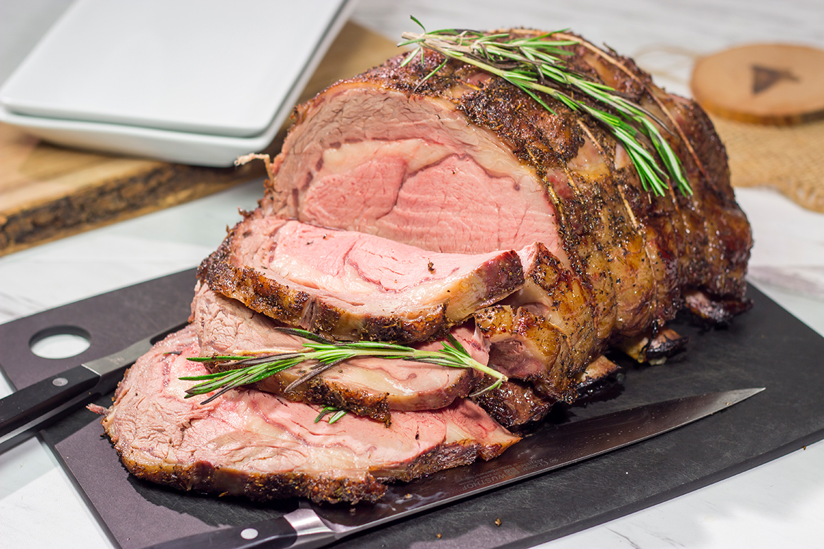Smoked Prime Rib is a company worthy meal! This prime rib roast (aka standing rib roast) is slow-smoked for flavor and then seared to create a delicious exterior crust.