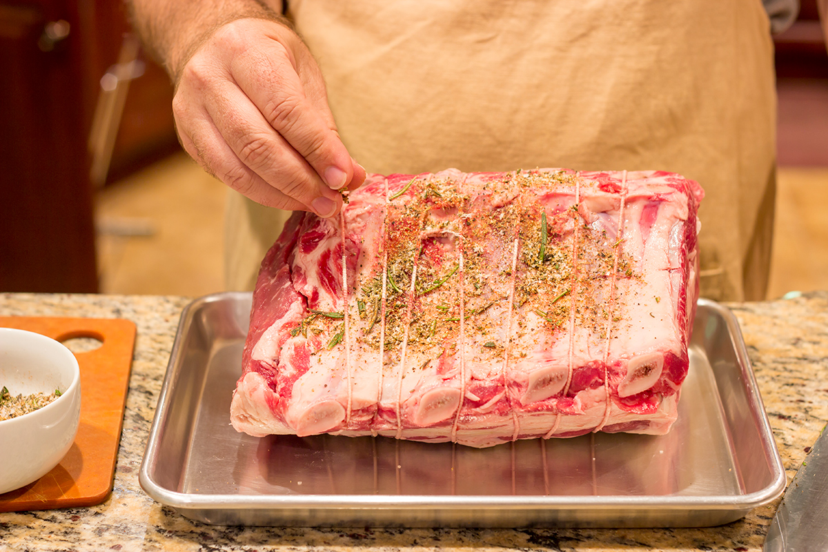 Smoked Prime Rib is a company worthy meal! This prime rib roast (aka standing rib roast) is slow-smoked for flavor and then seared to create a delicious exterior crust.