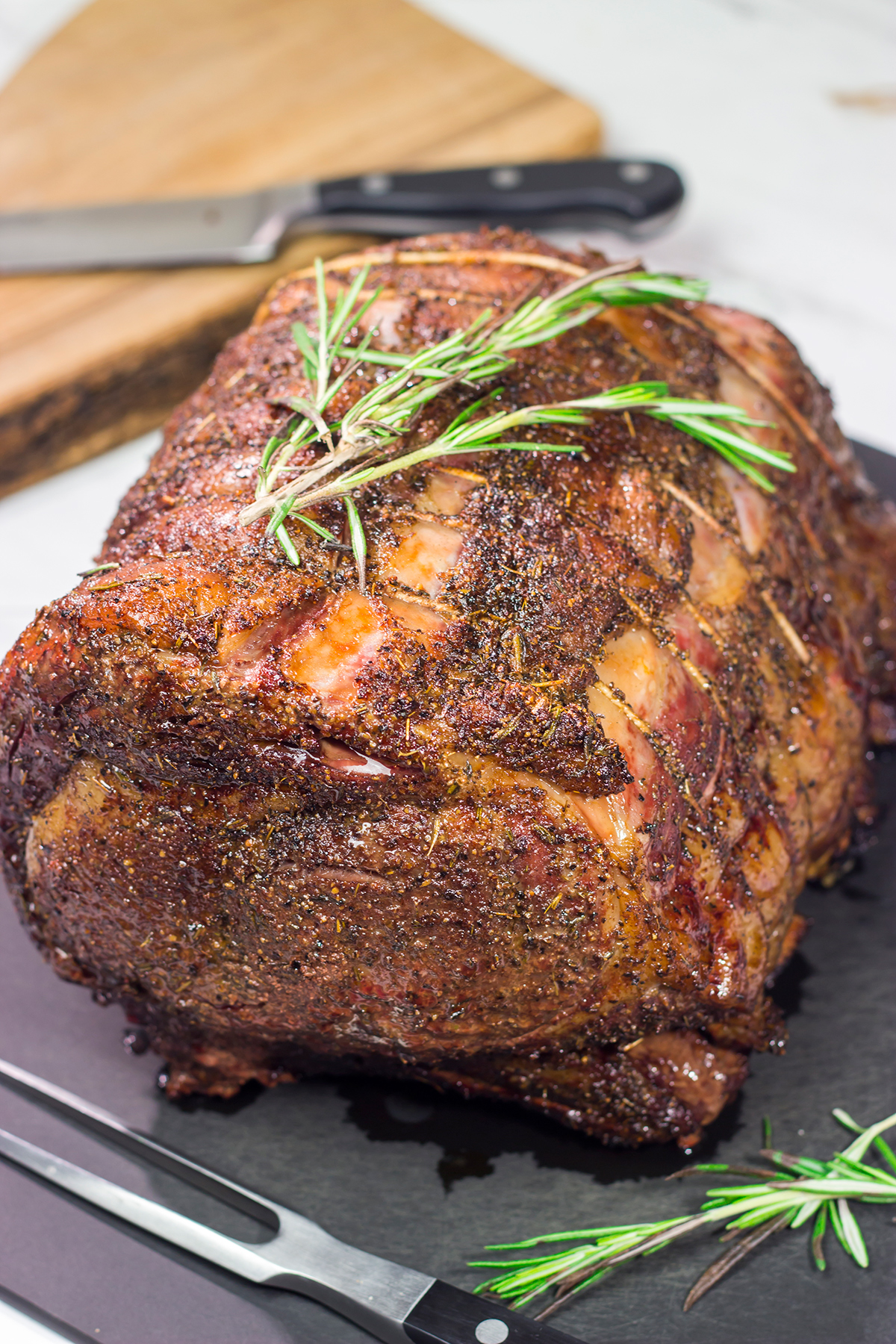 Smoked Prime Rib is a company worthy meal! This prime rib roast (aka standing rib roast) is slow-smoked for flavor and then seared to create a delicious exterior crust.