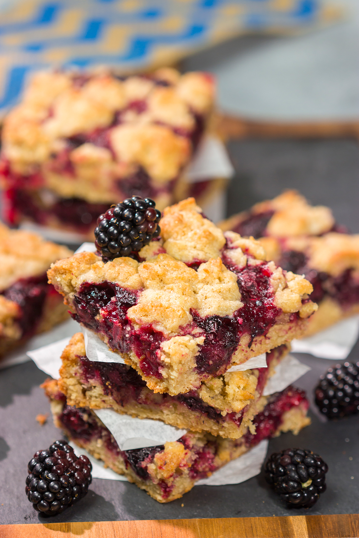 These Blackberry Crumb Bars are similar to a summer berry crumble...just in handheld form! They're filled with blackberry flavor, and they're easy to make!