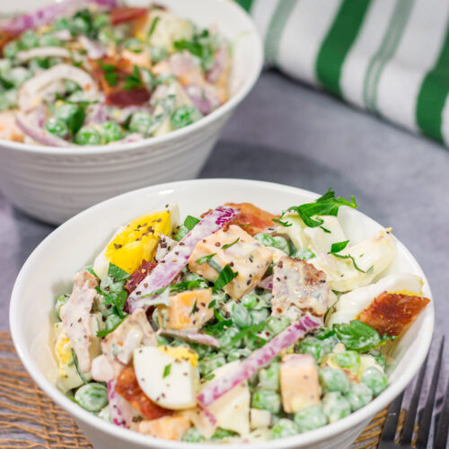 Packed with bacon and cheese, this Easy Pea Salad is a colorful and delicious side dish for summer meals and potlucks!