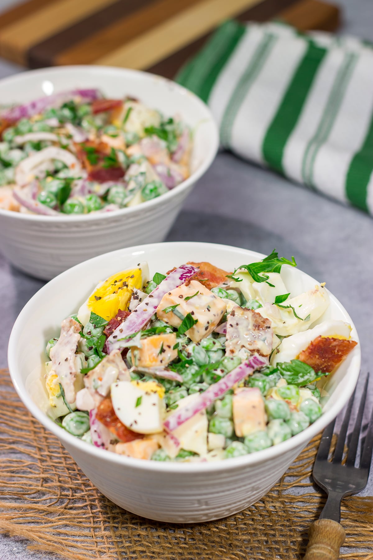 Packed with bacon and cheese, this Easy Pea Salad is a colorful and delicious side dish for summer meals and potlucks!