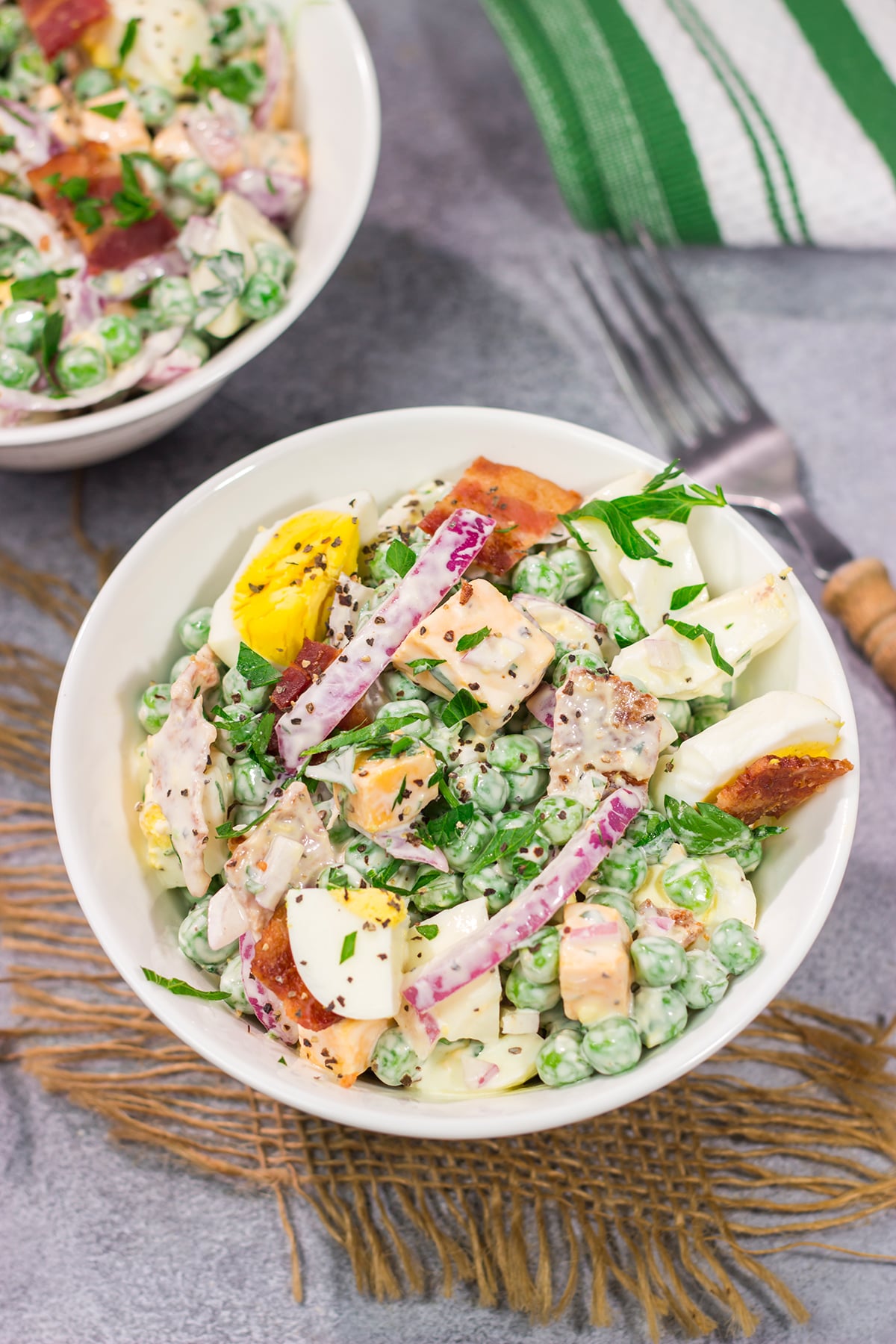 Packed with bacon and cheese, this Easy Pea Salad is a colorful and delicious side dish for summer meals and potlucks!
