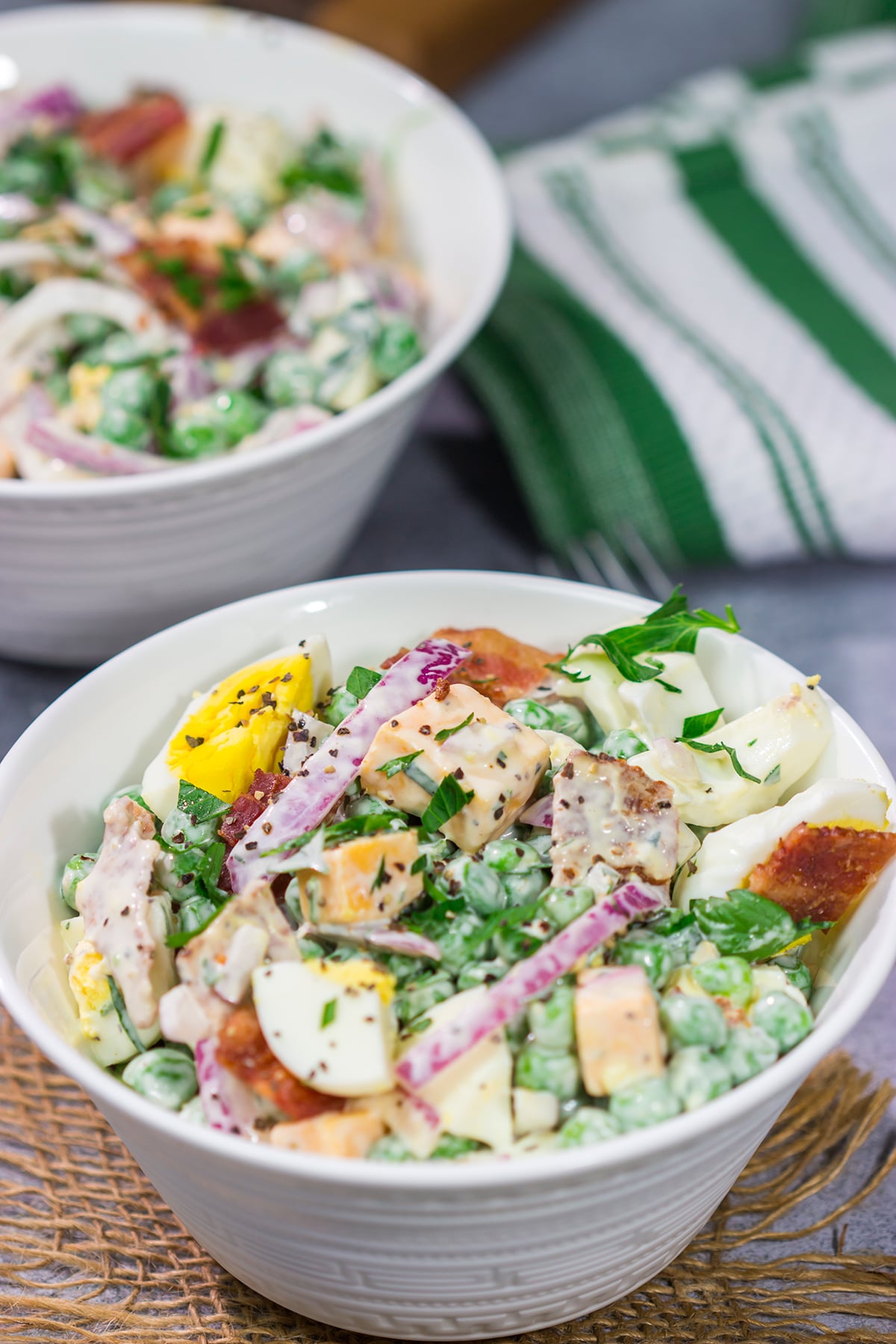 Packed with bacon and cheese, this Easy Pea Salad is a colorful and delicious side dish for summer meals and potlucks!