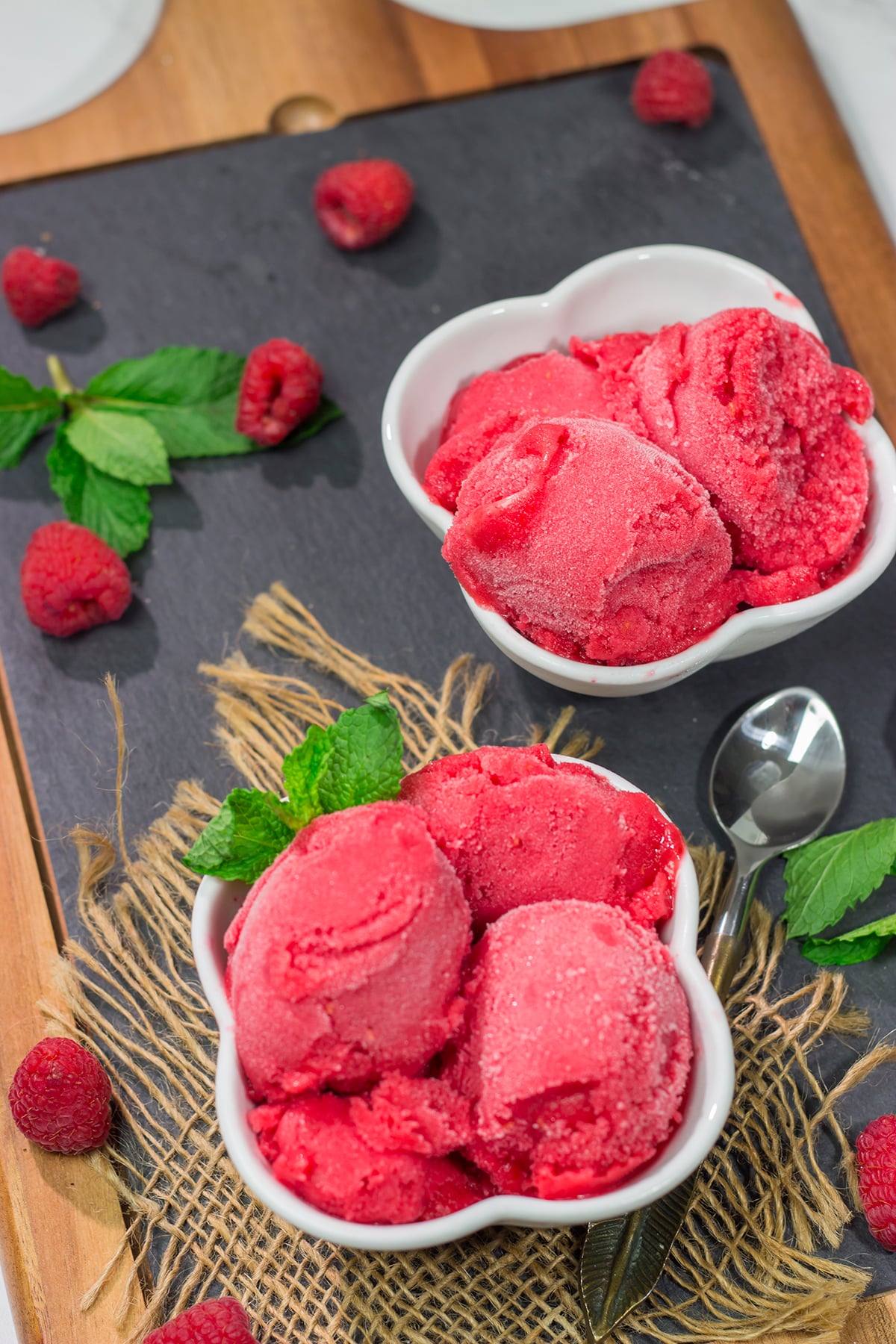 Looking for a tasty summer dessert? Whip up a batch of this Raspberry Sorbet! This dairy-free treat is perfect for warm summer evenings!