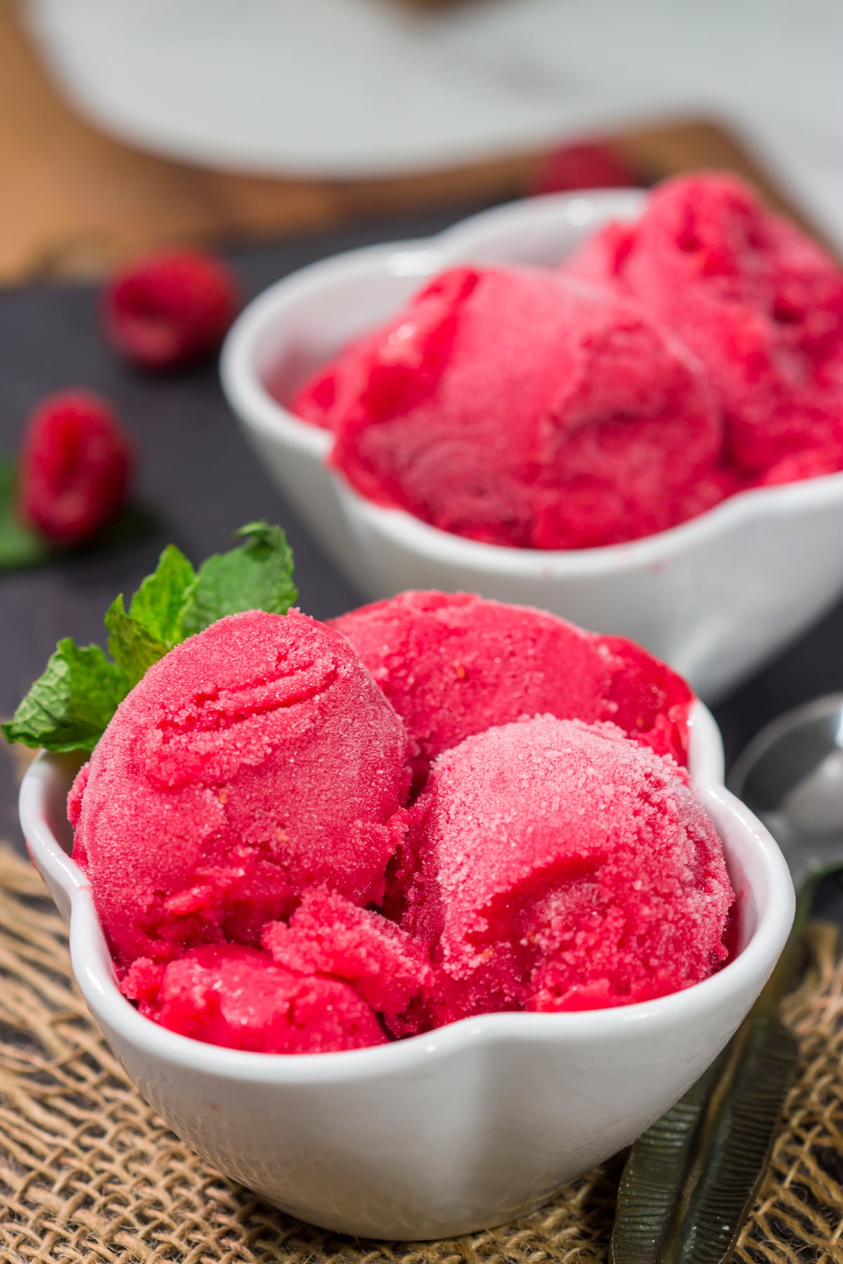 Looking for a tasty summer dessert? Whip up a batch of this Raspberry Sorbet! This dairy-free treat is perfect for warm summer evenings!